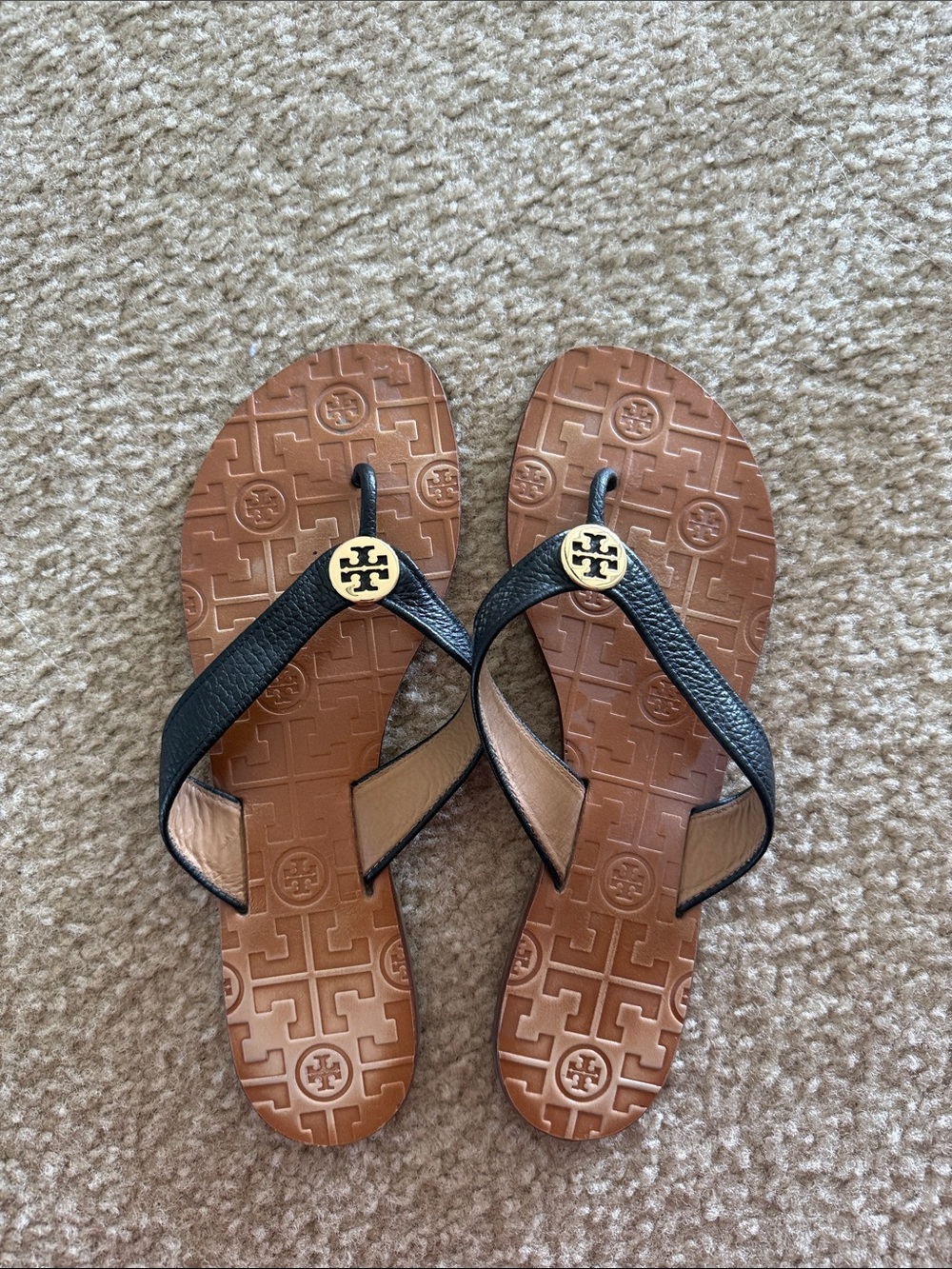 Tory Burch Black Leather Flip Sandals with Gold Logo on Brown Footbed